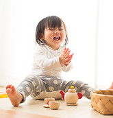 Toddler with Wooden Toys